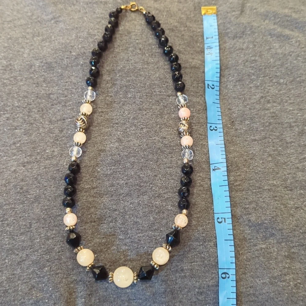 Women's black, pink‎ and clear ball necklace.